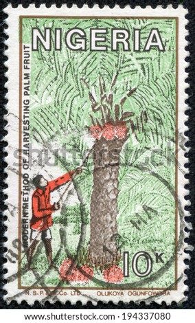 NIGERIA - CIRCA 1986: A stamp printed in Nigeria, shows modern method of harvesting palm fruit, circa 1986