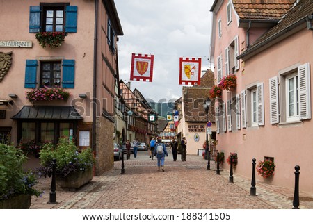 EGUISHEIM, FRANCE - SEPTEMBER 10, 2010: Eguisheim is a commune in Alsace in north-eastern France. Since 2003 Eguisheim is included into the list of the most beautiful villages of France.