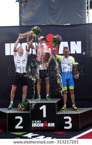 Copenhagen, Denmark, August 23rd, 2015. Brazilian Guilherme Manocchio (C),  Danish Henrik Hyldelund (L) and German Andreas Niedrig is on the podie as winners of men\'s KMD Ironman Copenhagen 70.3.