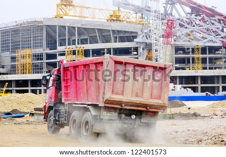 SOCHI,  RUSSIA - APRIL 29: Trucks on the construction of the main stadium with a capacity of 45,000 people on April 29, 2012 in SOCHI, RUSSIA. The cost of the project - 15.5 billion rubles.