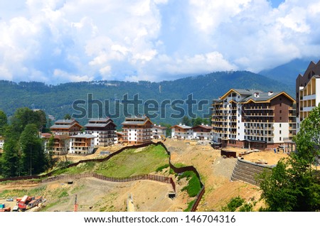 SOCHI,RUSSIA - JULY 10:Construction of new hotels in the mountain Olympic village on July 10, 2013 in Sochi, Russia. Capacity will reach 2,600 people. The Olympic village covers an area of 32 hectares