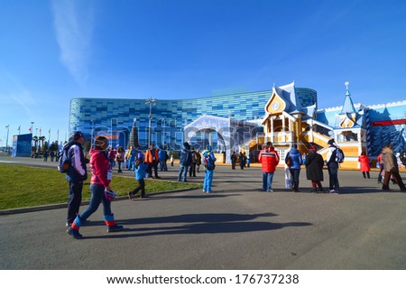 SOCHI, RUSSIA - FEBRUARY 7, 2014: Peoples near Ice rink for figure skating Iceberg in Olympic park a few hours before the opening ceremony of the Olympic Games 2014