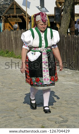 HOLLOKO, HUNGARY - APRIL 13 : Women in folk costume in the village during the traditional Easter Festival on April 13, 2009 in Holloko, Hungary. Village is UNESCO World Heritage Site