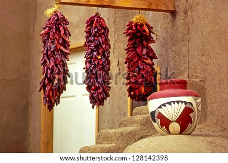 TAOS PUEBLO, NEW MEXICO, USA - JUNE 11: Dried peppers and Indian pottery of historic Taos Pueblo on June 11, 1996. This is the oldest city in the United States and World Heritage Site by UNESCO