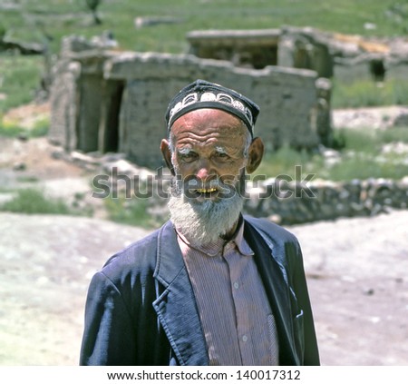 PAMIR-ALAY, TAJIKISTAN - JUNE 28: Village elder in the valley Zeravshan River on June 28, 1990. The Zarafshan is lost in the mountain region of Tajikistan, part of the Pamir-Alay mountains.