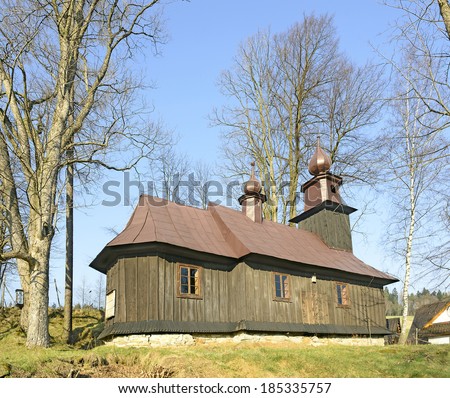 SKOMIELNA CZARNA, POLAND - MARCH 29: Wooden church of the Visitation of the Holy Virgin on March 29, 2014. The church belongs to a set of old wooden churches in Lesser Poland
