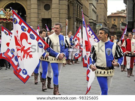 FLORENCE, ITALY - EASTER SUNDAY APRIL 16, 2006: Flag bearers walk in Easter parade wearing historical costumes on April 16, 2006, Florence, Italy. Celebration \