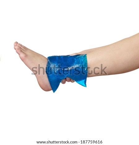 Acute pain in a woman ankle. Woman holding hand to spot of ankle-aches.