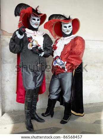 VENICE - MARCH 5: People in Venetian costume attend the Carnival of Venice, annual festival starting two weeks before Ash Wednesday and ends on Shrove Tuesday, on March 5, 2011 in Venice, Italy.
