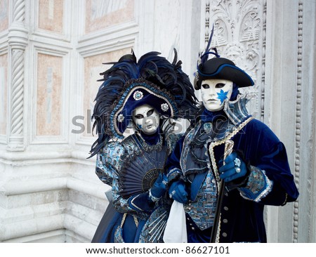 VENICE - MARCH 5: Couple in Venetian costume attend the Carnival of Venice, annual festival starting two weeks before Ash Wednesday and ends on Shrove Tuesday, on March 5, 2011 in Venice, Italy.