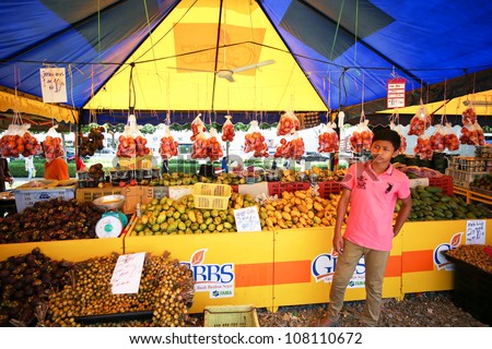 PUTRAJAYA - JULY 8: Fruits for sale at the Floral Festival on July 8, 2012 in Putrajaya, Malaysia. This flower themed event attracts thousands of visitors and exhibitors from all over the world.