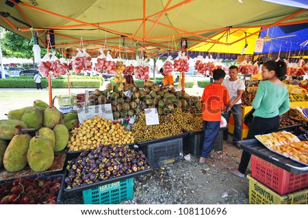 PUTRAJAYA - JULY 8: Fruits for sale at the Floral Festival on July 8, 2012 in Putrajaya, Malaysia. This flower themed event attracts thousands of visitors and exhibitors from all over the world.