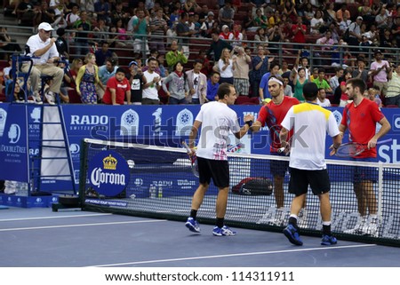 KUALA LUMPUR - SEP 30: The doubles finalists shake hand at the end of the match at the ATP Tour Malaysian Open 2012 on September 30, 2012 in Kuala Lumpur, Malaysia. A. Peya and B. Soares (white) won.