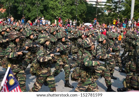 KUALA LUMPUR - AUGUST 31: Women infantry soldiers from the Malaysian Armed Forces march on the city streets celebrating Malaysia\'s Independence Day on August 31, 2013 in Kuala Lumpur, Malaysia.
