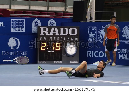 KUALA LUMPUR - SEPTEMBER 29: Joao Souso (Portugal) reacts after winning the final point and the match of singles final of the Malaysian Open 2013 in Putra Stadium, Malaysia on September 29, 2013.