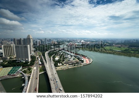 SINGAPORE - SEPTEMBER 16: An aerial view of Singapore river and coast line, buildings and highways on September 16, 2013 in Singapore. Singapore is South East Asia\'s financial capital.