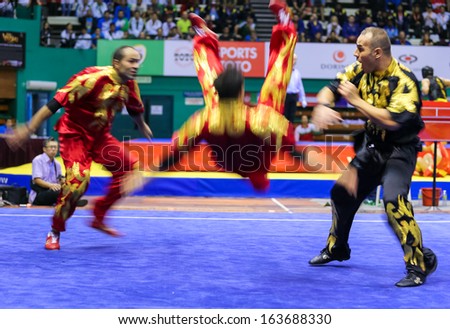 KUALA LUMPUR - NOV 05: Members of Iran's dalian team performs a fight scene in the Men's Dual Event at the 12th World Wushu Championship on November 05, 2013 in Kuala Lumpur, Malaysia.