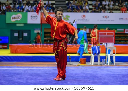 KUALA LUMPUR - NOV 03: Japan\'s Ryosuke Kishi performs with a sword in the Men\'s \'Daoshu\' Event at the 12th World Wushu Championship on November 03, 2013 in Kuala Lumpur, Malaysia.