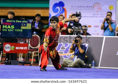 KUALA LUMPUR - NOV 03: Malaysia\'s Ng Say Yoke performs his fight routine in the Men\'s \'Daoshu\' Event at the 12th World Wushu Championship on November 03, 2013 in Kuala Lumpur, Malaysia.