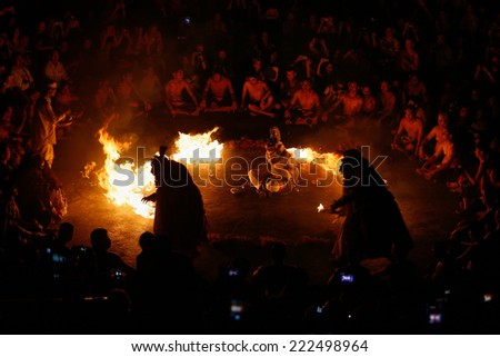 BALI, INDONESIA - SEPTEMBER 19, 2014: Hanuman is set to be burnt alive during a performance of the traditional Balinese Kecak Fire Dance at the Uluwatu Temple in Bali.