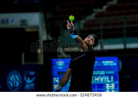 KUALA LUMPUR, MALAYSIA - SEPTEMBER 30, 2015: Nikoloz Basilashvili from Georgia serves in his match at the Malaysian Open 2015 Tennis tournament held at the Putra Stadium, Malaysia.