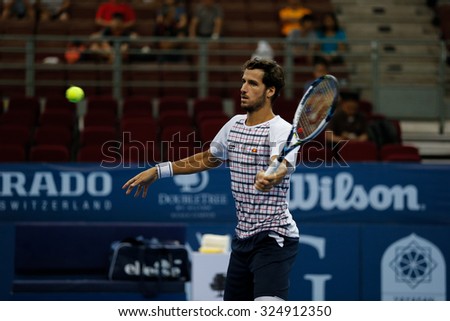 KUALA LUMPUR, MALAYSIA - OCTOBER 01, 2015: Feliciano Lopez of Spain plays a forehand volley during his match at the Malaysian Open 2015 Tennis tournament held at the Putra Stadium, Malaysia.