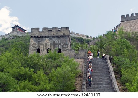 BEIJING, CHINA - JUNE 5: Tourist climb the steps along the Great Wall of China June 5, 2009 in Beijing, China.