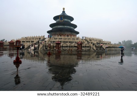 BEIJING, CHINA - JUNE 8: Tourists walk by at the Temple of Heavens after the rain June 8, 2009 in Beijing, China.