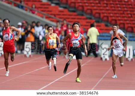 KUALA LUMPUR - AUGUST 15: Amputees run the 100m race at the track and field event of the fifth ASEAN Para Games on August 15, 2009 in Kuala Lumpur, Malaysia.