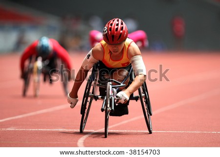 KUALA LUMPUR - AUGUST 15: Vietnam\'s wheel chair athlete leads the 800m race at the track and field event of the fifth ASEAN Para Games on August 15, 2009 in Kuala Lumpur.