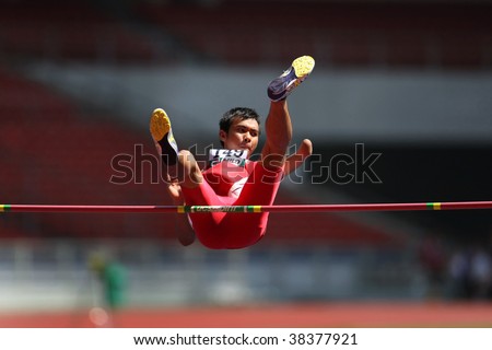 KUALA LUMPUR - AUGUST 16: Amputee high jump athlete in a successful jump at the track and field event of the fifth ASEAN Para Games on August 16, 2009 in Kuala Lumpur, Malaysia.
