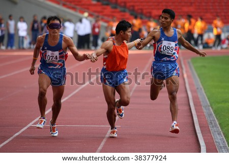 KUALA LUMPUR - AUGUST 18: Thailand\'s visually impaired relay team in action at the track and field event of the fifth ASEAN Para Games on August 18, 2009 in Kuala Lumpur, Malaysia.