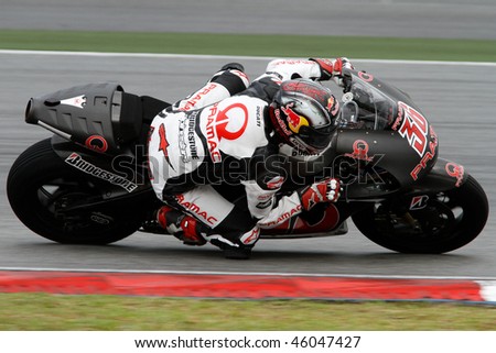 SEPANG - FEBRUARY 05: Mika Kallio of the Pramac Racing team practices in the pre-season testing in preparation for the MotoGP championship. February 05, 2010 in Sepang, Malaysia.