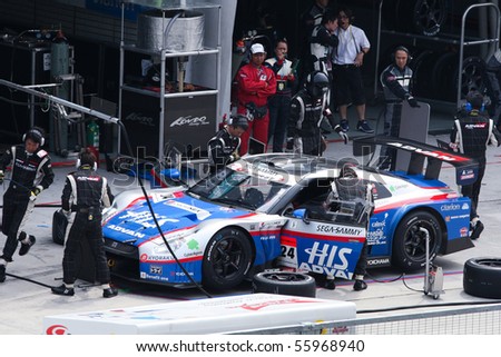 SEPANG, MALAYSIA - JUNE 21: The HIS Advan Kondo GT-R car (24) during a pit stop at the Super GT International Series Round 4 race. June 21, 2010 in Sepang Malaysia.