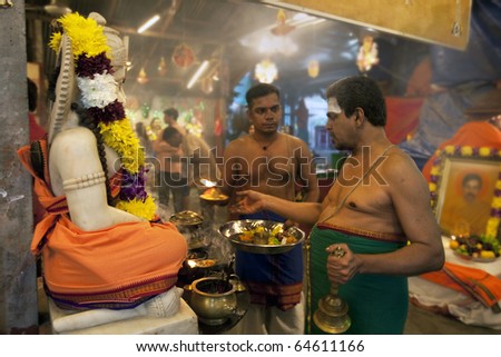 KUALA LUMPUR, MALAYSIA - NOVEMBER 5: Temple priests offer prayers on Diwali festival day on November 5, 2010 at the Hanuman Temple in Kuala Lumpur.  Diwali celebrates the triumph of good over evil.