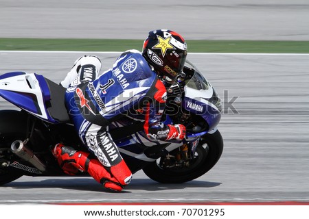 SEPANG, MALAYSIA - FEBRUARY 2: MotoGP rider Jorge Lorenzo of the Yamaha Factory Racing practices at the MotoGP winter tests at the Sepang International Circuit on February 2, 2011 in Malaysia.