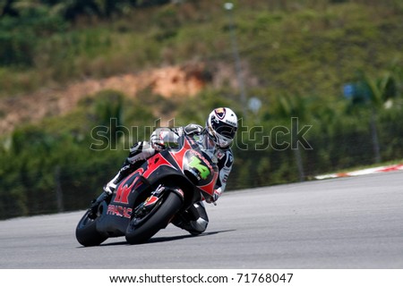 SEPANG, MALAYSIA - FEBRUARY 22: MotoGP rider Randy de Puniet of Pramac Racing Team practices at the 2011 MotoGP winter tests at the Sepang International Circuit on February 22, 2011 in Malaysia.