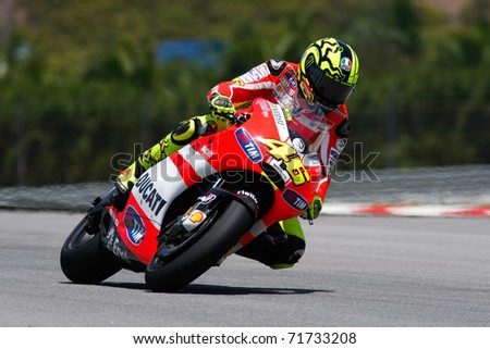 SEPANG, MALAYSIA - FEBRUARY 22: MotoGP rider Valentino Rossi of the Ducati Malboro Team practices at the 2011 MotoGP winter tests at the Sepang International Circuit on February 22, 2011 in Sepang, Malaysia