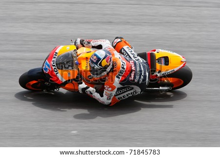 SEPANG, MALAYSIA - FEBRUARY 23: MotoGP rider Andrea Dovizioso of Repsol Honda Team practices at the 2011 MotoGP winter tests at the Sepang International Circuit. February 23, 2011 in Malaysia.