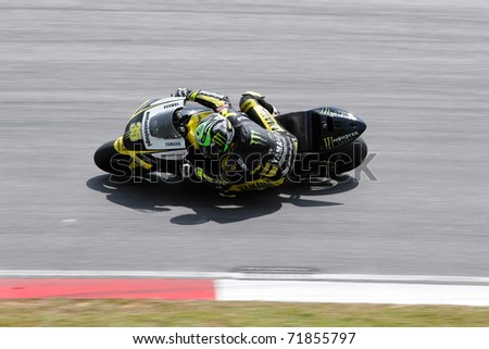 SEPANG, MALAYSIA - FEBRUARY 23: MotoGP rider Cal Crutchlow of the Monster Yamaha Tech 3 practices at the 2011 MotoGP winter tests at the Sepang International Circuit. February 23, 2011 in Malaysia.