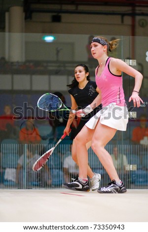 B.JALIL, MALAYSIA - MARCH 16: Heba El Torky (Egypt) in black takes on Sarah Kippax (England) at the CIMB KL Open Squash Championship 2011 at the National Squash Centre. on March 16, 2011 in Malaysia.