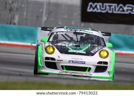 SEPANG - JUNE 17: Sasha Chu (11) of the Asia Racing Team in a Porsche takes to the tracks of the Sepang International Circuit at the GT Asia Series race on June 17, 2011 in Sepang, Malaysia.