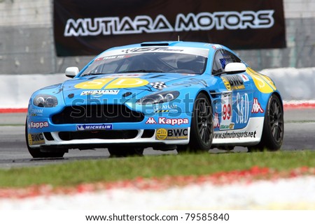 SEPANG - JUNE 17: Frank Yee of S&D Motorsports in a Aston Martin Vantage N24 takes to the tracks of the Sepang International Circuit at the GT Asia Series race on June 17, 2011 in Sepang, Malaysia.