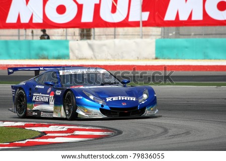 SEPANG - JUNE 18: The Honda HSV-010 car of Keihin Real Racing puts in some practice laps in the Sepang International Circuit during the Japan SUPER GT Round 3 on June 18, 2011 in Sepang, Malaysia.