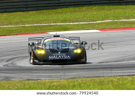 SEPANG - JUNE 18: The Mosler MT900M car of ThunderAsia Racing puts in some practice laps in the Sepang International Circuit at the Japan SUPER GT Round 3 on June 18, 2011 in Sepang, Malaysia.