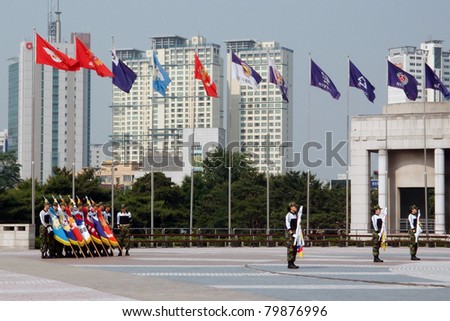 SEOUL, SOUTH KOREA - JUNE 08: Honor Guards from the marines perform a gun drill at the Korean War Memorial Museum on June 08, 2011 in Seoul, South Korea. South Korea is still technically at war with North Korea.