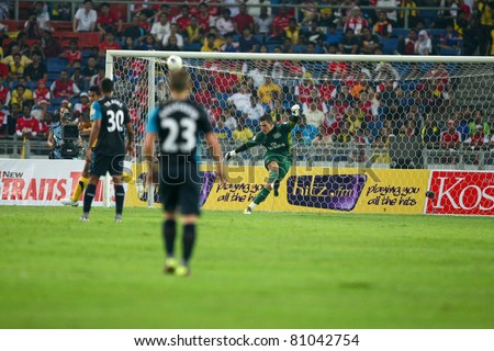 BUKIT JALIL - JULY 13: Arsenal's goal-keeper Vito Mannone (green) kicks a clearance away from goal on July 13, 2011 in Stadium Bukit Jalil, Malaysia. English league team Arsenal is on an Asia Tour.