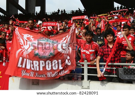 BUKIT JALIL, MALAYSIA - JULY 16: Liverpool soccer fans cheer during the game between Malaysia and English premier league club Liverpool in the National Stadium on July 16, 2011, Bukit Jalil, Malaysia.