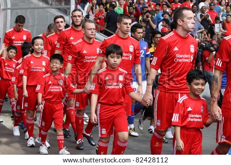 BUKIT JALIL - JULY 16: Liverpool FC players enter the pitch at the start of the friendly against Malaysia at the National Stadium on July 16, 2011, Bukit Jalil, Malaysia.  Liverpool won the match 6-3.