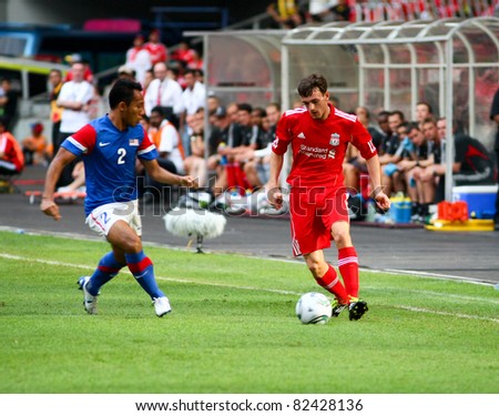 BUKIT JALIL, MALAYSIA - JULY 16: Liverpool\'s Jack Robinson (red) dribbles the ball in the game against Malaysia at the National Stadium on July 16, 2011, Bukit Jalil, Malaysia. Liverpool won 6-3.